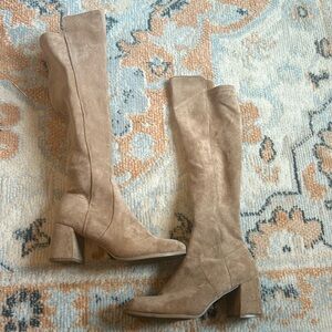 Suede beige knee high boots.